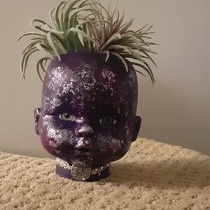 Hand painted doll head planter